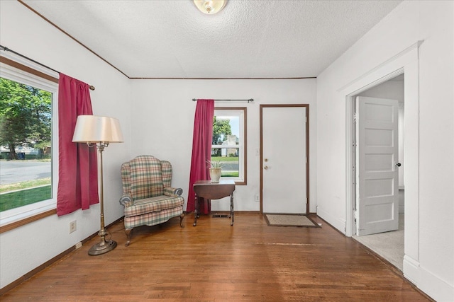 2304 E Dalke Ave, Spokane, WA 99207 - foyer entrance featuring wood finished floors, a textured ceiling, and baseboards