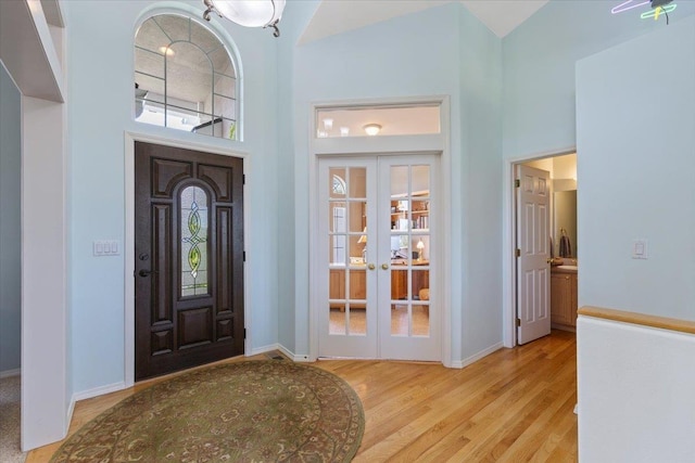7920 S Parway Ln, Cheney, WA 99004 - foyer entrance featuring french doors, a high ceiling, wood finished floors, and baseboards