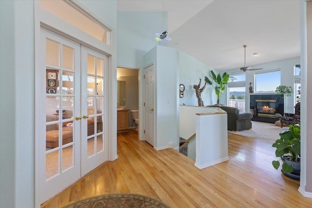 7920 S Parway Ln, Cheney, WA 99004 - corridor featuring french doors, an upstairs landing, and wood finished floors