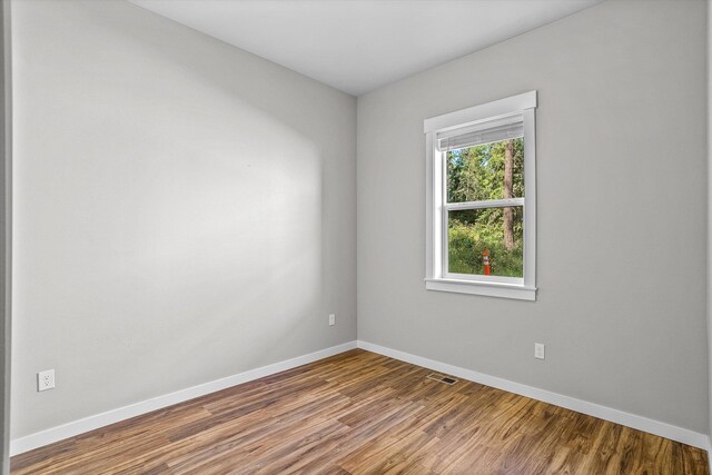 40083 Lake Terrace Ct, Loon Lake, WA 99148 - unfurnished room with wood finished floors and baseboards
