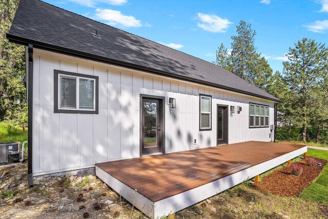 40083 Lake Terrace Ct, Loon Lake, WA 99148 - rear view of property with a deck, central AC unit, board and batten siding, and roof with shingles