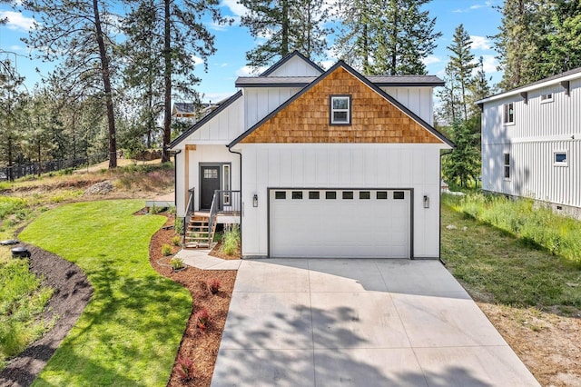 40083 Lake Terrace Ct, Loon Lake, WA 99148 - view of front facade featuring a front lawn, concrete driveway, and an attached garage