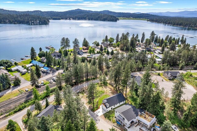 40083 Lake Terrace Ct, Loon Lake, WA 99148 - aerial perspective of suburban area with a water and mountain view and a heavily wooded area