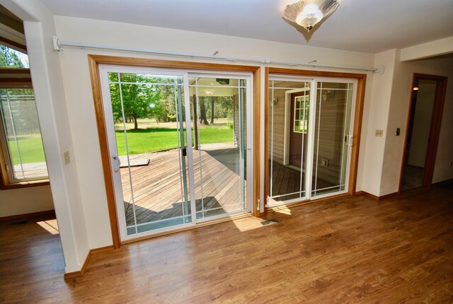 3704 E Pineland Rd, Colbert, WA 99005 - doorway to outside featuring baseboards and wood finished floors