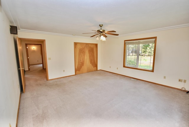 3704 E Pineland Rd, Colbert, WA 99005 - unfurnished bedroom with baseboards, light colored carpet, crown molding, and a closet