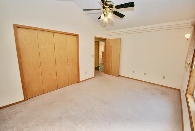 3704 E Pineland Rd, Colbert, WA 99005 - unfurnished bedroom featuring carpet, vaulted ceiling, baseboards, a ceiling fan, and a closet