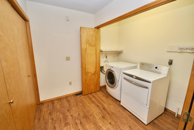 3704 E Pineland Rd, Colbert, WA 99005 - laundry room featuring independent washer and dryer, light wood finished floors, and baseboards