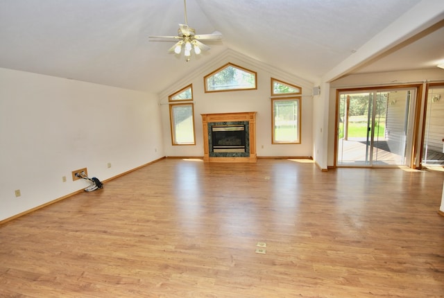 3704 E Pineland Rd, Colbert, WA 99005 - unfurnished living room featuring a high end fireplace, plenty of natural light, vaulted ceiling, ceiling fan, and light wood-style floors