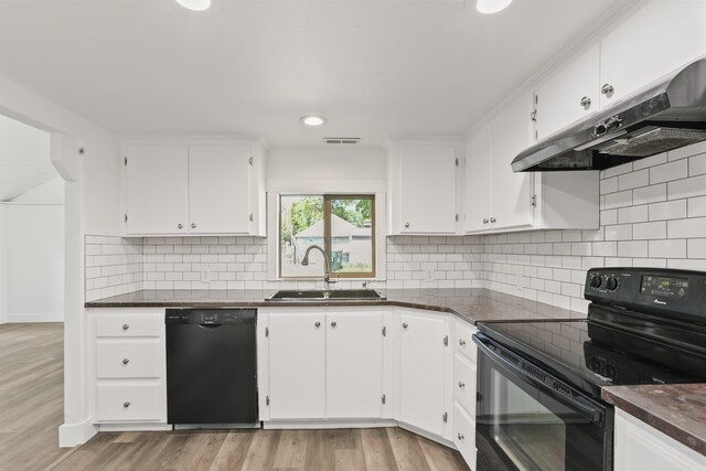 13812 E Rockwell Ave, Spokane, WA 99216 - kitchen with black appliances, under cabinet range hood, a sink, white cabinets, and dark countertops