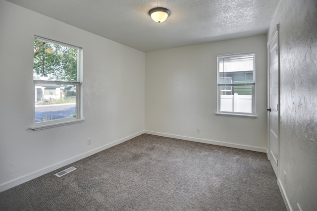 5320 N Ash St, Spokane, WA 99205 - unfurnished room with carpet floors, a textured ceiling, and baseboards