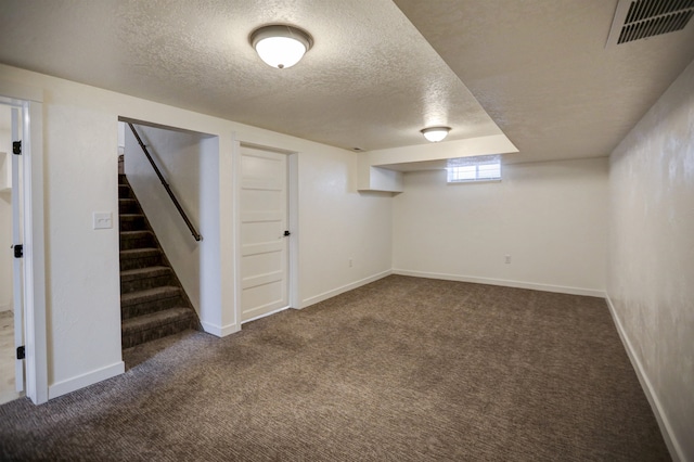 5320 N Ash St, Spokane, WA 99205 - below grade area featuring a textured ceiling, dark colored carpet, stairs, and baseboards