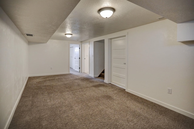 5320 N Ash St, Spokane, WA 99205 - finished basement featuring a textured ceiling, carpet floors, and baseboards