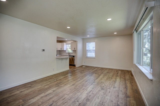 5320 N Ash St, Spokane, WA 99205 - unfurnished living room featuring recessed lighting, wood finished floors, and baseboards