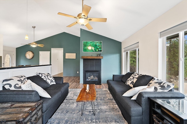 5814 Jergens Rd Unit B, Nine Mile Falls, WA 99026 - living area featuring a ceiling fan, wood finished floors, lofted ceiling, and a tile fireplace