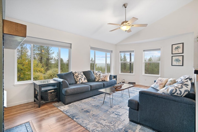 5814 Jergens Rd Unit B, Nine Mile Falls, WA 99026 - living room featuring vaulted ceiling, light wood-type flooring, baseboards, and a ceiling fan