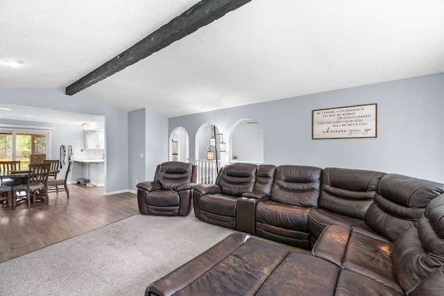 4615 E Russell Rd, Colbert, WA 99005 - carpeted living area with arched walkways, wood finished floors, a textured ceiling, and baseboards