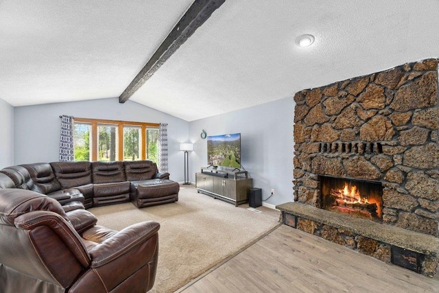 4615 E Russell Rd, Colbert, WA 99005 - living room featuring a stone fireplace, a textured ceiling, and wood finished floors
