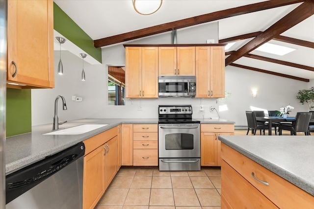 2111 E 34th Ave, Spokane, WA 99203 - kitchen with stainless steel appliances, a sink, light brown cabinets, light tile patterned flooring, and a baseboard radiator