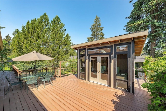 2111 E 34th Ave, Spokane, WA 99203 - wooden terrace with french doors and outdoor dining area
