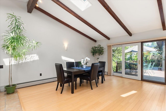 2111 E 34th Ave, Spokane, WA 99203 - dining area featuring baseboard heating, light wood-type flooring, a skylight, and a baseboard heating unit
