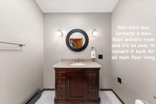 2111 E 34th Ave, Spokane, WA 99203 - bathroom with vanity, baseboards, and baseboard heating