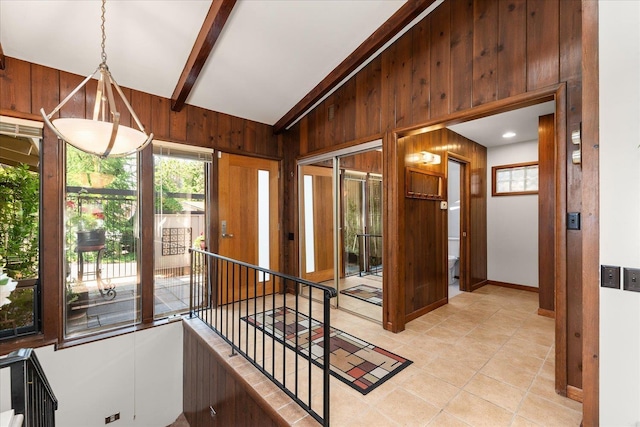 2111 E 34th Ave, Spokane, WA 99203 - corridor featuring wooden walls, light tile patterned floors, baseboards, and lofted ceiling