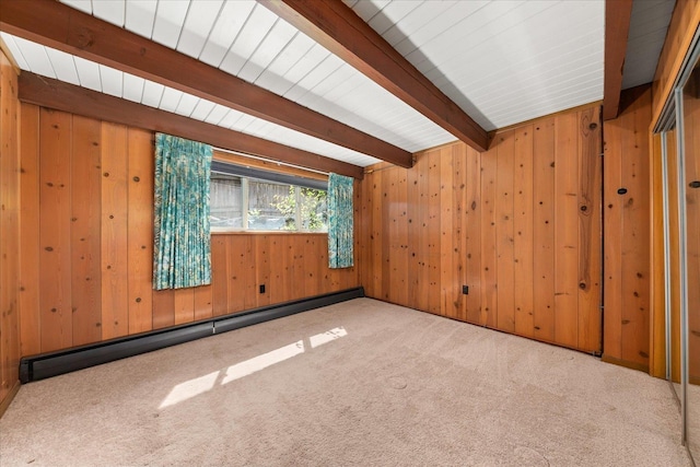 2111 E 34th Ave, Spokane, WA 99203 - carpeted empty room featuring beamed ceiling, wood walls, and baseboard heating
