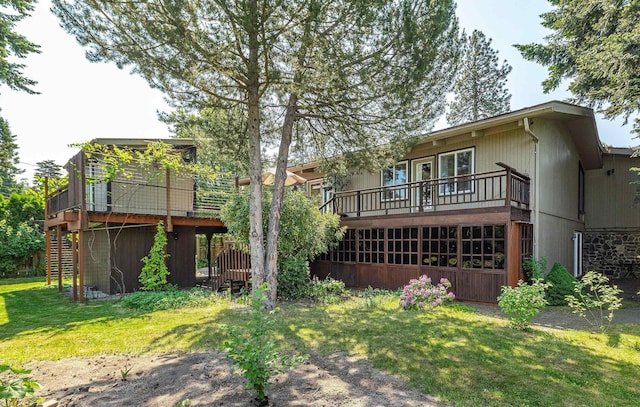 2111 E 34th Ave, Spokane, WA 99203 - rear view of property featuring a lawn, a wooden deck, and stairway
