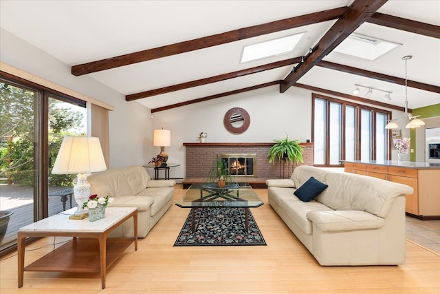2111 E 34th Ave, Spokane, WA 99203 - living area with a skylight, a brick fireplace, and light wood-style floors