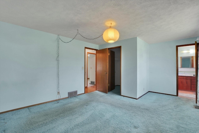 11619 N Roundup Rd, Mead, WA 99021 - unfurnished room featuring light colored carpet, baseboards, and a textured ceiling