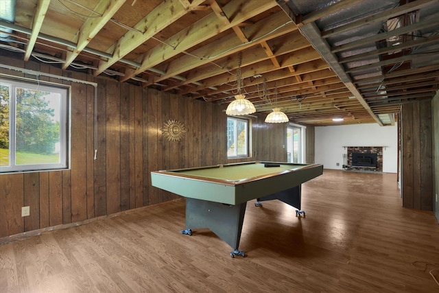 11619 N Roundup Rd, Mead, WA 99021 - recreation room with billiards, wood finished floors, wooden walls, and a stone fireplace