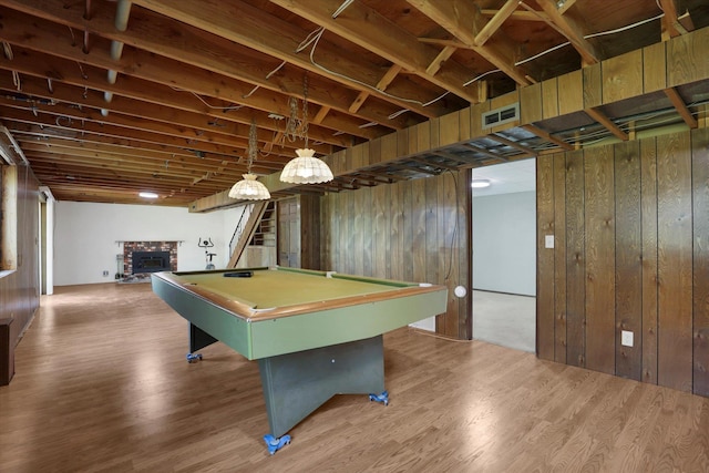 11619 N Roundup Rd, Mead, WA 99021 - recreation room featuring billiards, a brick fireplace, wood walls, and wood finished floors