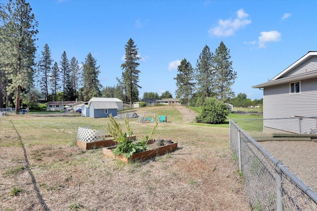 11619 N Roundup Rd, Mead, WA 99021 - view of yard with a garden and an outbuilding