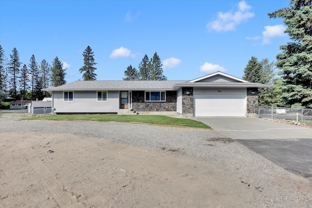 11619 N Roundup Rd, Mead, WA 99021 - single story home featuring an attached garage, stone siding, and concrete driveway