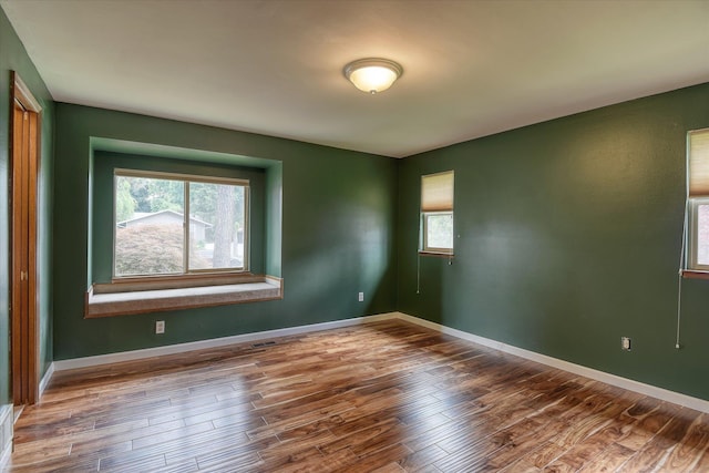 1815 E 64th Ave, Spokane, WA 99223 - unfurnished room with wood finished floors and baseboards
