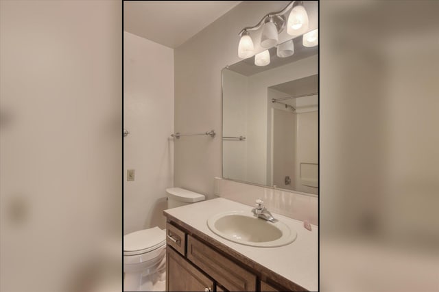 1815 E 64th Ave, Spokane, WA 99223 - bathroom with vanity, toilet, and a shower