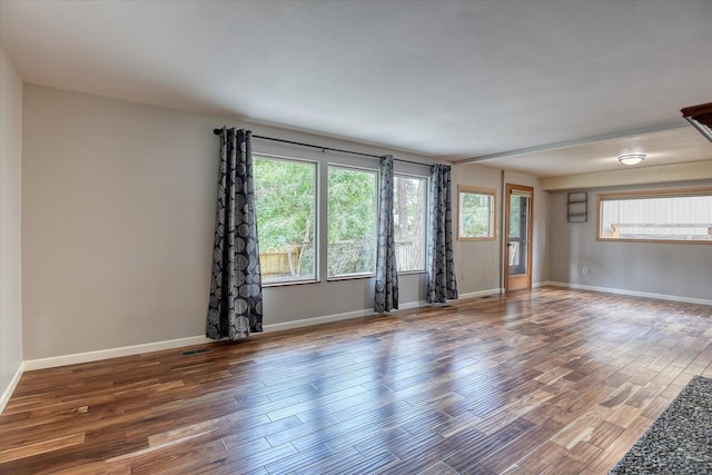 1815 E 64th Ave, Spokane, WA 99223 - unfurnished room featuring wood finished floors and baseboards