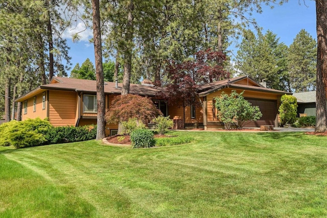 1815 E 64th Ave, Spokane, WA 99223 - ranch-style home featuring an attached garage and a front lawn