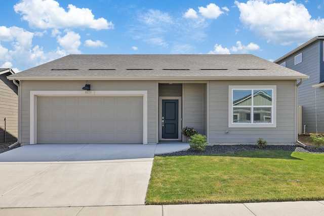 8113 S Safflower St, Cheney, WA 99004 - view of front facade featuring concrete driveway, a front lawn, and a garage