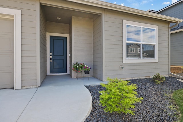 8113 S Safflower St, Cheney, WA 99004 - doorway to property with a garage