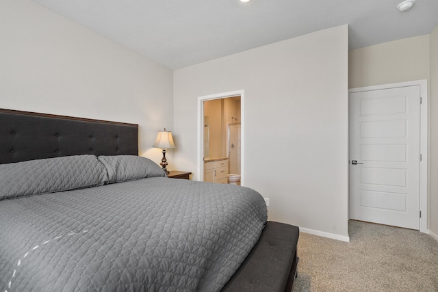 8113 S Safflower St, Cheney, WA 99004 - bedroom with light carpet, baseboards, and connected bathroom
