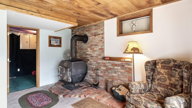 36918 N Valley Rd, Chattaroy, WA 99003 - living area featuring carpet floors, wood ceiling, and a wood stove