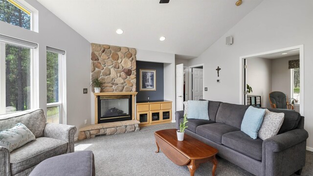 36918 N Valley Rd, Chattaroy, WA 99003 - living area with carpet flooring, high vaulted ceiling, healthy amount of natural light, a stone fireplace, and recessed lighting