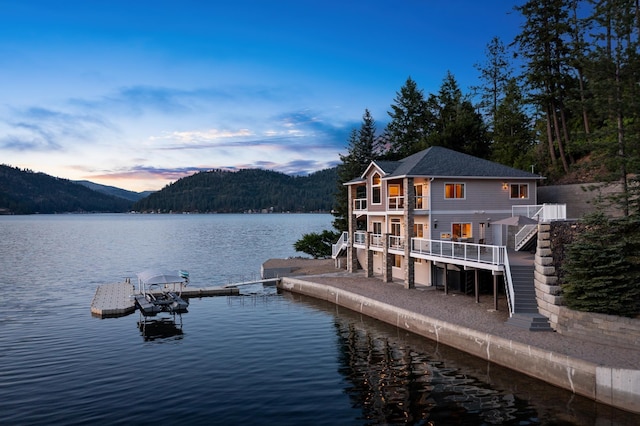 3907 E Pine Bay Way, Loon Lake, WA 99148 - dock featuring stairway, a water and mountain view, and a balcony