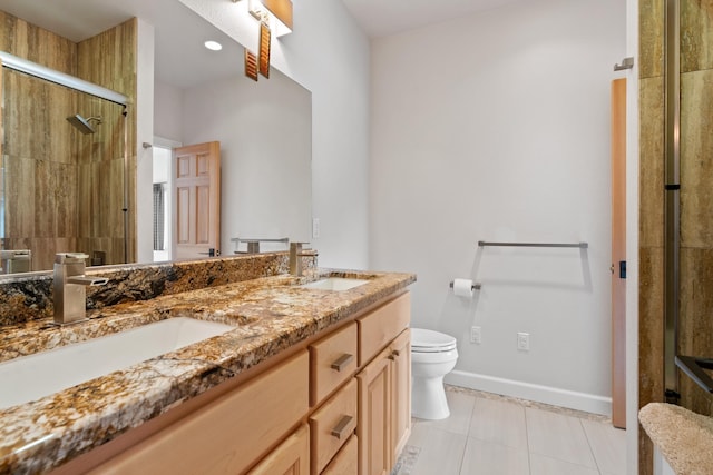 3907 E Pine Bay Way, Loon Lake, WA 99148 - full bath with a shower stall, toilet, double vanity, tile patterned floors, and baseboards