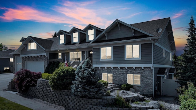 2306 W Rainier Ct, Spokane, WA 99208 - craftsman house with covered porch, stairway, and brick siding