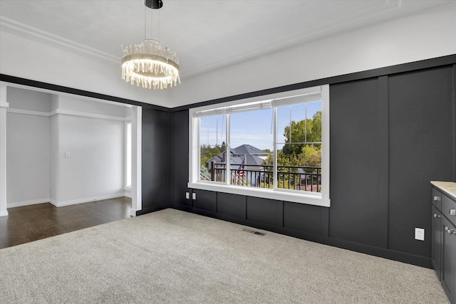 2306 W Rainier Ct, Spokane, WA 99208 - unfurnished bedroom with carpet flooring, a chandelier, and baseboards