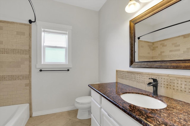 2306 W Rainier Ct, Spokane, WA 99208 - bathroom with tile patterned flooring, vanity, tasteful backsplash, toilet, and bathing tub / shower combination