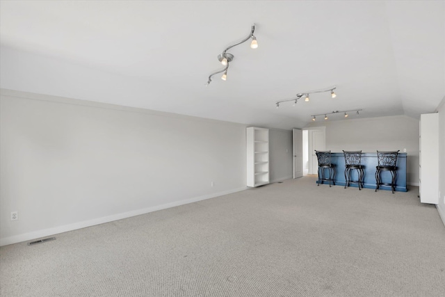 2306 W Rainier Ct, Spokane, WA 99208 - unfurnished living room with carpet flooring, baseboards, and lofted ceiling