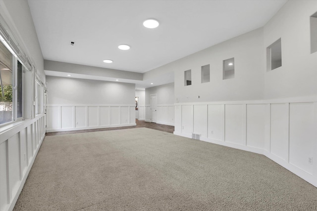 2306 W Rainier Ct, Spokane, WA 99208 - carpeted spare room featuring a decorative wall, recessed lighting, and wainscoting